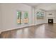 Spacious living room features hardwood floors, fireplace, and access to an outdoor patio through French doors at 4117 Flat Rock Pt, Stonecrest, GA 30038