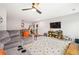 Large bonus room with a comfortable sectional, entertainment center, and ample space for play at 639 Tigers Eye Ter, Kennesaw, GA 30144