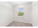 Bright, walk-in closet featuring carpet, wire shelving, and a window at 639 Tigers Eye Ter, Kennesaw, GA 30144