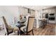Eat-in kitchen with a glass-topped table and seating for four at 639 Tigers Eye Ter, Kennesaw, GA 30144
