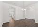 Open floor plan showing dining room with views into the kitchen at 639 Tigers Eye Ter, Kennesaw, GA 30144