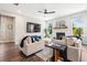 Inviting living room with a fireplace, stylish decor, and bright natural light from large windows at 639 Tigers Eye Ter, Kennesaw, GA 30144