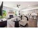 Cozy living room with fireplace, large windows, and comfortable furnishings at 639 Tigers Eye Ter, Kennesaw, GA 30144
