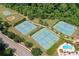An aerial view of community sports including tennis courts, basketball court, baseball field, and outdoor pool at 151 Rolling Hills Pl, Canton, GA 30114