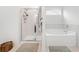 Bright bathroom featuring glass shower, soaking tub, and neutral tile at 151 Rolling Hills Pl, Canton, GA 30114