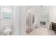 Well-lit bathroom boasts glass shower, soaking tub, toilet, and neutral tones at 151 Rolling Hills Pl, Canton, GA 30114