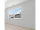 Bright bedroom featuring a light neutral paint and large window with ample natural light at 151 Rolling Hills Pl, Canton, GA 30114