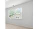 Bedroom featuring a light neutral paint and large window with ample natural light at 151 Rolling Hills Pl, Canton, GA 30114
