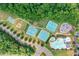 Aerial shot showcasing the community's pool, tennis, baseball and basketball facilities at 151 Rolling Hills Pl, Canton, GA 30114