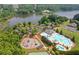 Aerial view of a community pool, playground, and lake surrounded by trees at 151 Rolling Hills Pl, Canton, GA 30114