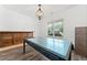 Dining room featuring stylish light fixture, wainscoting, and hardwood flooring at 151 Rolling Hills Pl, Canton, GA 30114