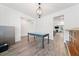 Formal dining area featuring wainscoting, a chandelier, and hardwood floors at 151 Rolling Hills Pl, Canton, GA 30114