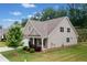 Exterior view of a craftsman-style home with well-maintained lawn at 151 Rolling Hills Pl, Canton, GA 30114