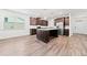 Bright kitchen boasts dark wood cabinetry, stainless appliances, granite countertops, and a central island at 151 Rolling Hills Pl, Canton, GA 30114