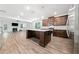Open kitchen with island, stainless appliances, and modern finishes at 151 Rolling Hills Pl, Canton, GA 30114