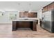 Spacious kitchen featuring a center island, stainless steel appliances, and modern cabinets at 151 Rolling Hills Pl, Canton, GA 30114
