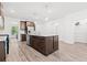 Bright kitchen features wooden floors, dark cabinets, granite countertops, and a spacious kitchen island at 151 Rolling Hills Pl, Canton, GA 30114