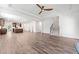 Open-concept living space with a kitchen, dining area, and staircase, all featuring hardwood floors at 151 Rolling Hills Pl, Canton, GA 30114