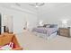 Spacious main bedroom offers natural light, carpet, and neutral décor at 151 Rolling Hills Pl, Canton, GA 30114