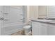 Bathroom with tub-shower combo, modern vanity, and neutral finishes at 2296 Waycross Ln, Dacula, GA 30019