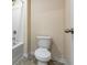 Bathroom featuring a toilet and tub with shower head at 2296 Waycross Ln, Dacula, GA 30019