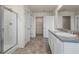 Bathroom with double sinks, walk-in shower, and neutral paint at 2296 Waycross Ln, Dacula, GA 30019