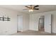 Bedroom featuring a ceiling fan, carpeted floor, and neutral wall paint at 2296 Waycross Ln, Dacula, GA 30019
