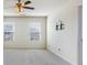 Bright bedroom with ceiling fan and large windows at 2296 Waycross Ln, Dacula, GA 30019