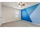 Carpeted bedroom features an accent wall and a ceiling fan at 2296 Waycross Ln, Dacula, GA 30019