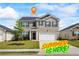 Charming two-story home with a well-manicured lawn and a two-car garage in a suburban neighborhood at 2296 Waycross Ln, Dacula, GA 30019