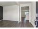 Elegant foyer with wood-look floors and decorative wall paneling leading into the home at 2296 Waycross Ln, Dacula, GA 30019