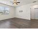 Well-lit living room featuring a ceiling fan, large window, and TV mount at 2296 Waycross Ln, Dacula, GA 30019