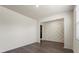 Open-concept living room with wood-look floors and decorative wall accents near entryway at 2296 Waycross Ln, Dacula, GA 30019