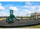 Community playground with a slide and swing set, surrounded by black mulch at 2296 Waycross Ln, Dacula, GA 30019