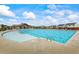 Community swimming pool with lounge chairs and a clubhouse nearby at 2296 Waycross Ln, Dacula, GA 30019