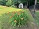 Backyard with flowers and shed at 3962 Chicamauga Ne Dr, Kennesaw, GA 30144