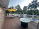 Backyard deck with dining and fire pit overlooking a swimming pool at 3962 Chicamauga Ne Dr, Kennesaw, GA 30144