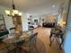 Open concept layout with an adjacent kitchen, dining area, and living room, all bathed in natural light at 3962 Chicamauga Ne Dr, Kennesaw, GA 30144