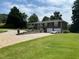 Charming brick home featuring a two-car garage, a spacious lawn, and a patterned brick driveway at 3962 Chicamauga Ne Dr, Kennesaw, GA 30144