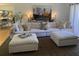 Bright living area with a large sectional couch, soft rug, and decorative lamps at 3962 Chicamauga Ne Dr, Kennesaw, GA 30144