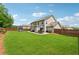 Large, well-maintained backyard featuring a patio, play area, and lush lawn at 422 Silver Brook Dr, Woodstock, GA 30188