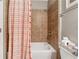 Stylish bathroom featuring tile surround, shower head, and neutral colors at 422 Silver Brook Dr, Woodstock, GA 30188