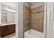 Bathroom features a tile shower and vanity sink with granite counters and dark cabinetry at 422 Silver Brook Dr, Woodstock, GA 30188