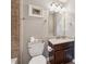 Half bath with granite counters and decorative fixtures at 422 Silver Brook Dr, Woodstock, GA 30188