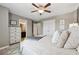 Comfortable bedroom featuring soft lighting, a ceiling fan and ensuite bathroom at 422 Silver Brook Dr, Woodstock, GA 30188