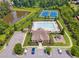 Aerial view of community pool, clubhouse, playground, tennis courts, and parking at 422 Silver Brook Dr, Woodstock, GA 30188