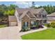 Beautiful two-story home with brick and siding exterior, attached two car garage, and manicured lawn at 422 Silver Brook Dr, Woodstock, GA 30188