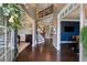 Grand foyer with hardwood floors, staircase, and view into other rooms at 422 Silver Brook Dr, Woodstock, GA 30188