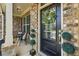 Charming front porch with decorative wreath, seating, and meticulous landscaping at 422 Silver Brook Dr, Woodstock, GA 30188