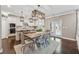 Charming eat-in kitchen with stainless steel appliances, an island with bar seating, and stylish pendant lighting at 422 Silver Brook Dr, Woodstock, GA 30188